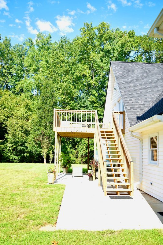 The staircase down from the raised deck to the garden.
