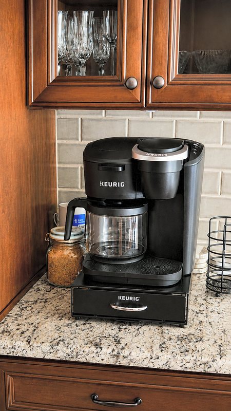 A coffee machine set up on the kitchen worktop.